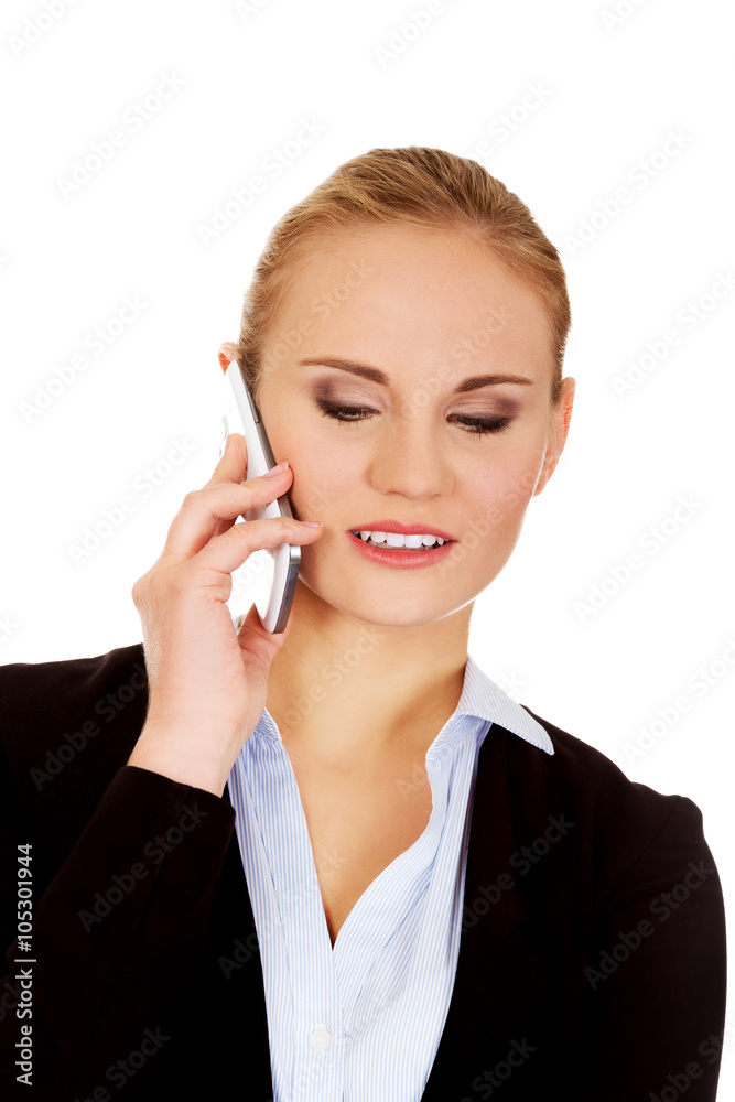 Smiling business woman talking through the phone. Smiling business woman talking through the phone.