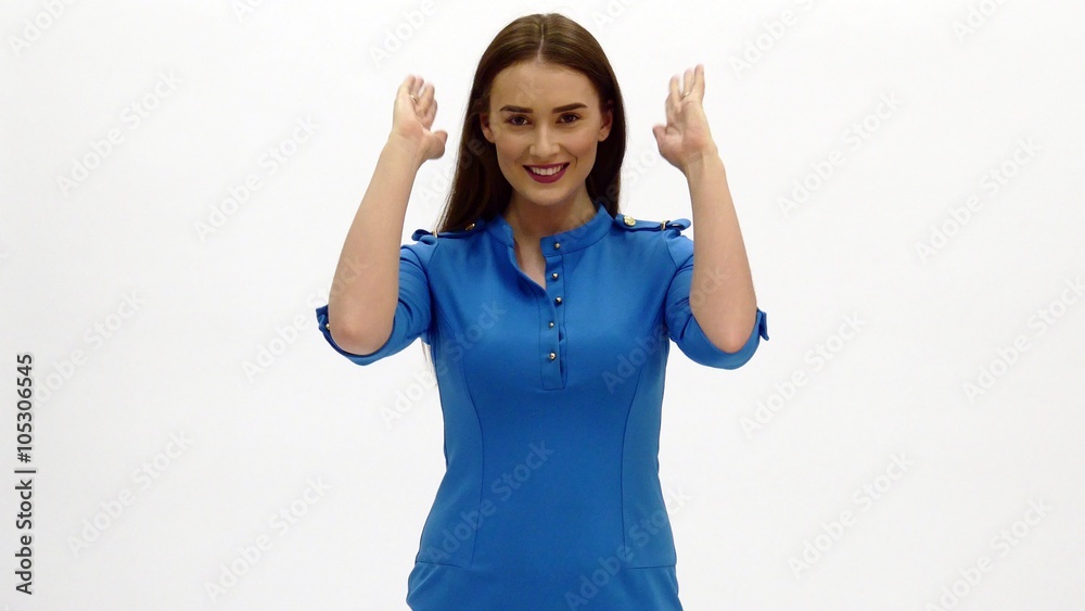 Air hostess in blue uniform. Shows the way to emergency exit. Air hostess in blue uniform. Shows the way to emergency exit.