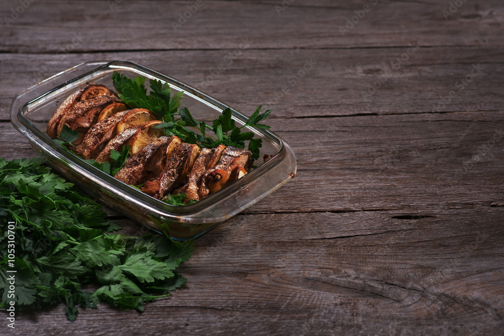 Salmon baked in the oven with lemon and fresh herbs Salmon baked in the oven with lemon and fresh herbs