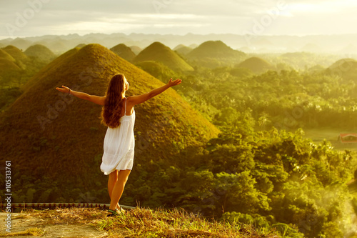 woman doing yoga in The Chocolate Hills. Bohol, Philippines photo