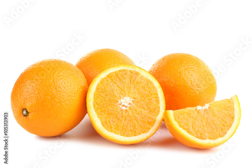 large and delicious sliced oranges laid out on a white isolated background
