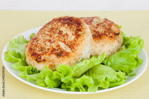 fish cutlet on a plate lettuce