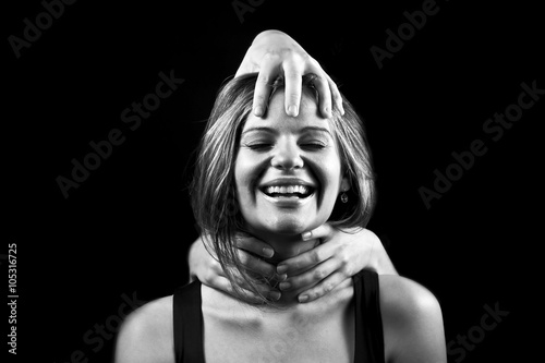 portrait of emotional young woman and lot of hands
