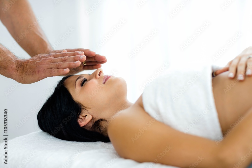 Pregnant woman receiving a spa treatment from masseur Pregnant woman receiving a spa treatment from masseur