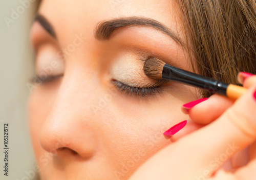 Applying eyeshadow on eyelid. © viki2103stock
