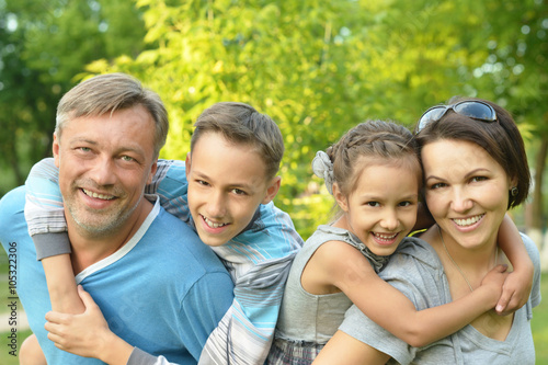 Family resting in summer park