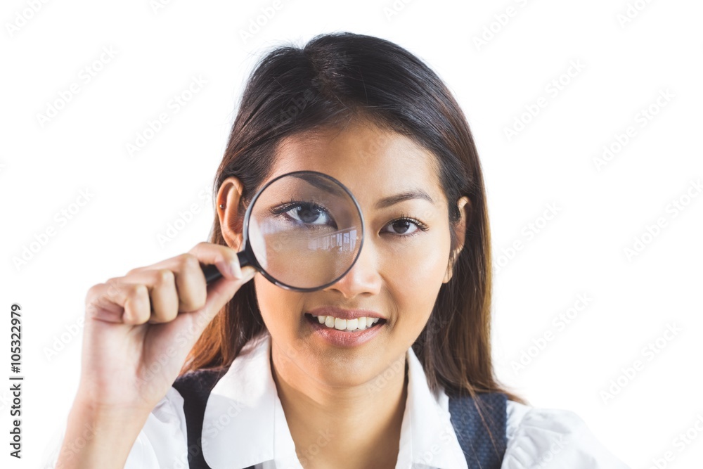 Businesswoman looking through magnifying glass Businesswoman looking through magnifying glass