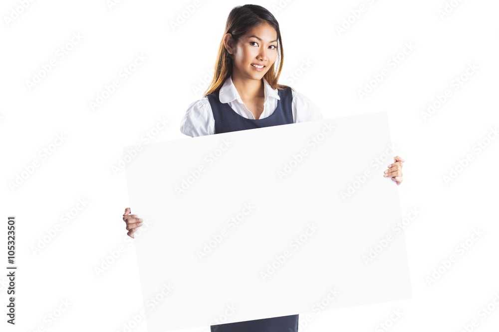 Smiling businesswoman holding a white poster Smiling businesswoman holding a white poster