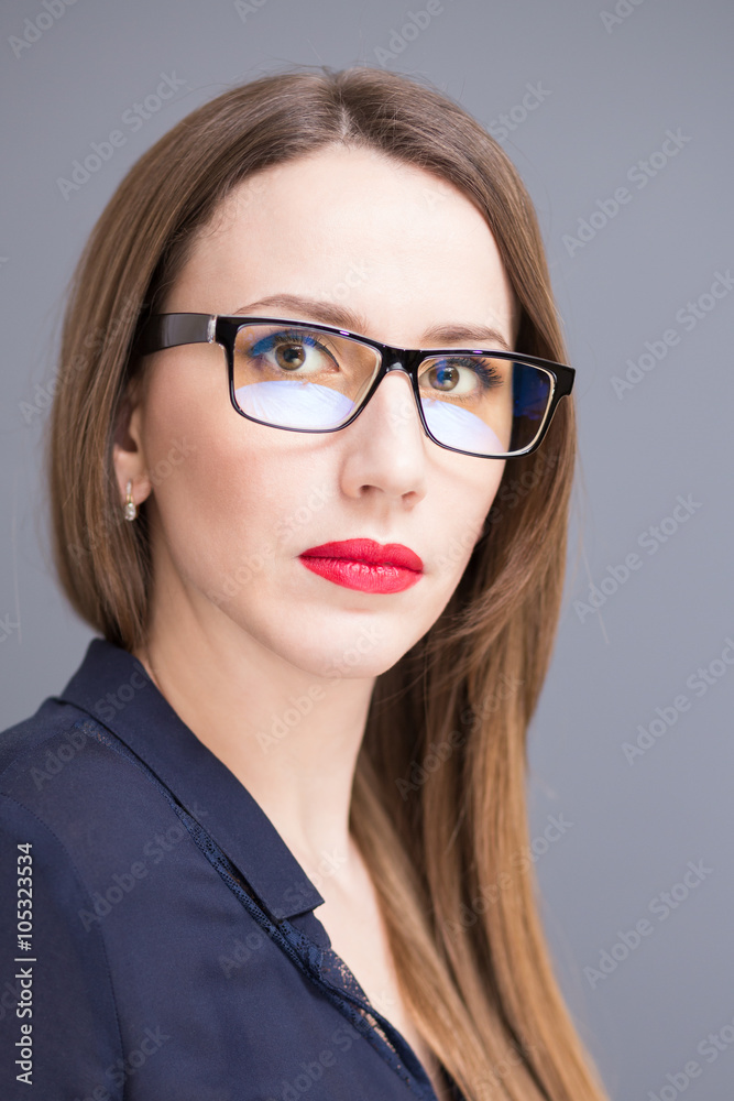Young confident business woman in glasses