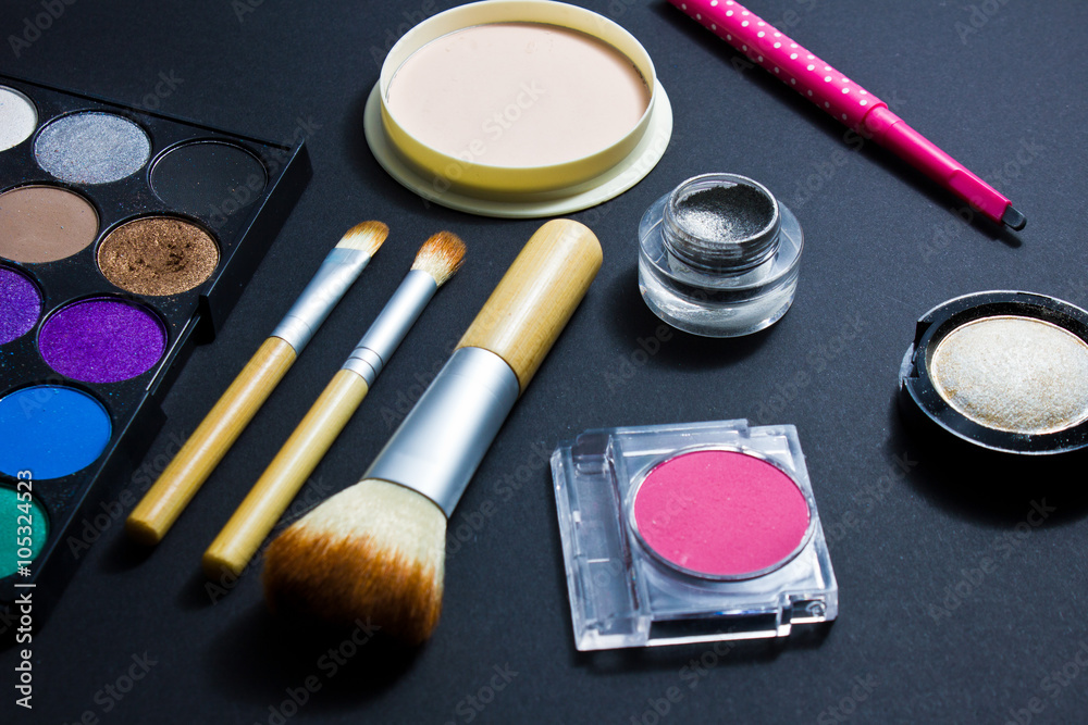 Set of professional cosmetics for make-up on black background. Set of professional cosmetics for make-up on black background.