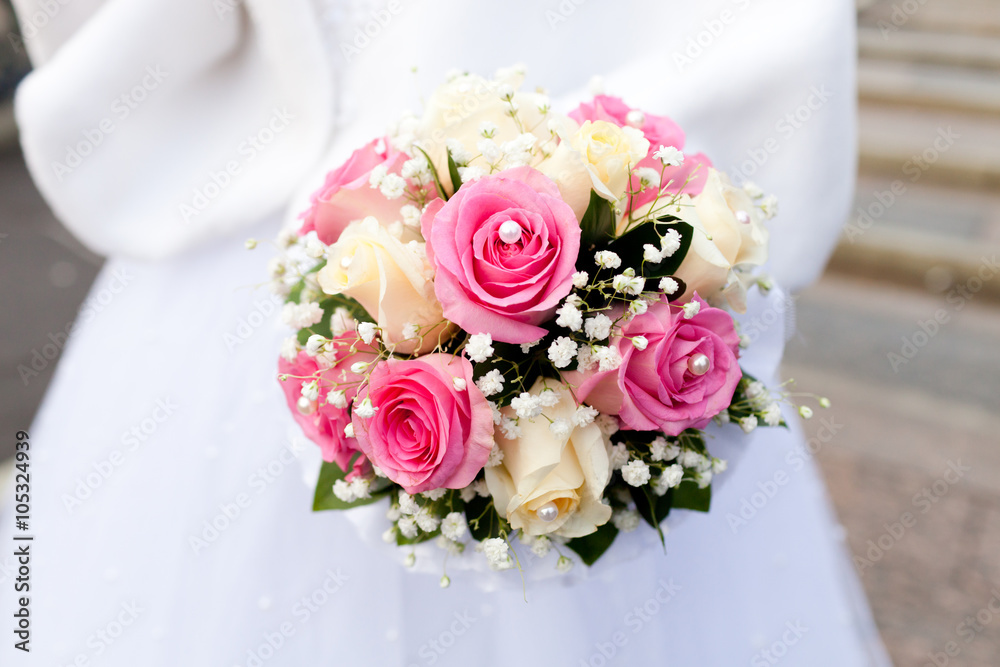 Beautiful wedding bouquet of flowers in bride’s hands Beautiful wedding bouquet of flowers in bride’s hands