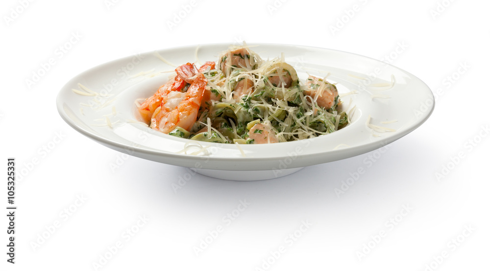 Pasta with shrimps and salmon. Front view.