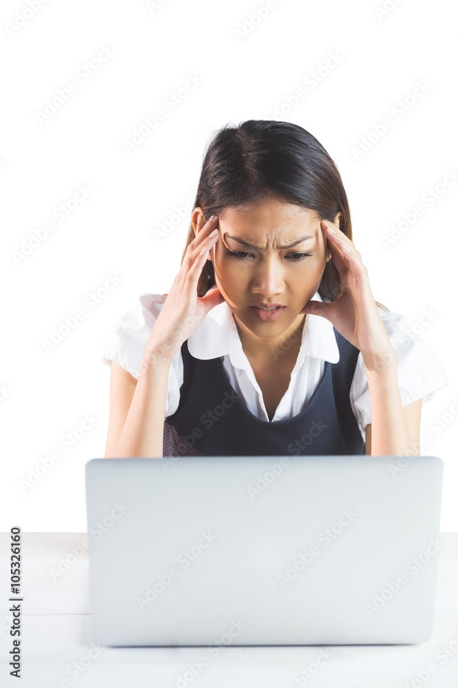 Nervous businesswoman using a laptop Nervous businesswoman using a laptop
