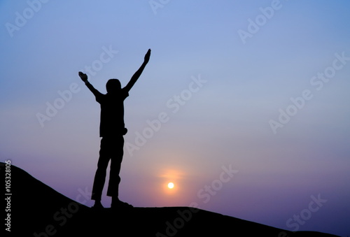 Wallpaper Mural Silhouette picture of a man stretch the arms on the hill Torontodigital.ca