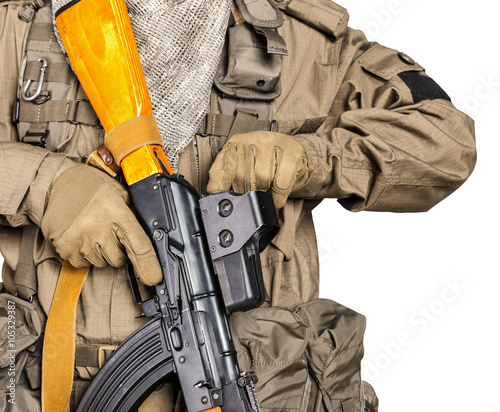 Special forces soldier with rifle on white background