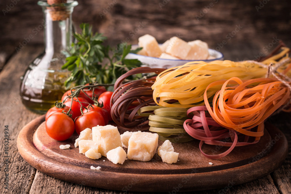  Vegetable color Pasta, oil,tomatoes,cheese on wooden table. italian food