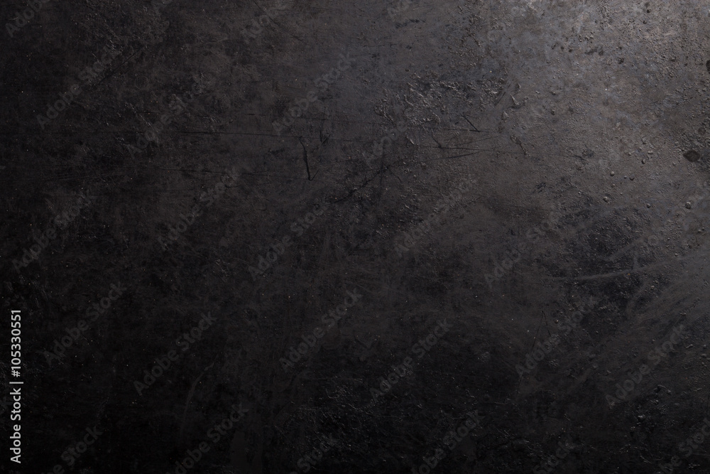 Black metal background. The surface of the pan to the oven Black metal background. The surface of the pan to the oven