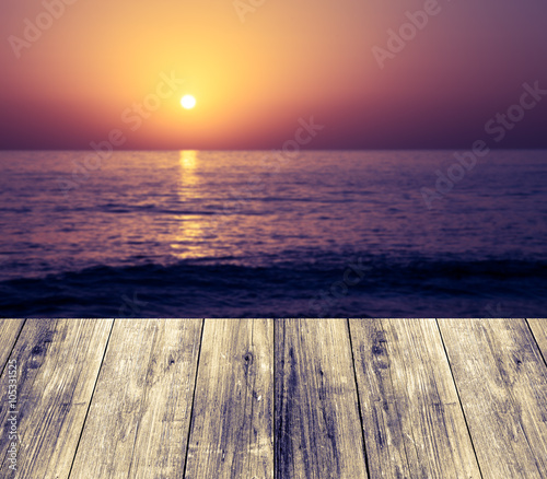 Beautiful view of the Mediterranean Sea over old light wooden ta © strannik_fox