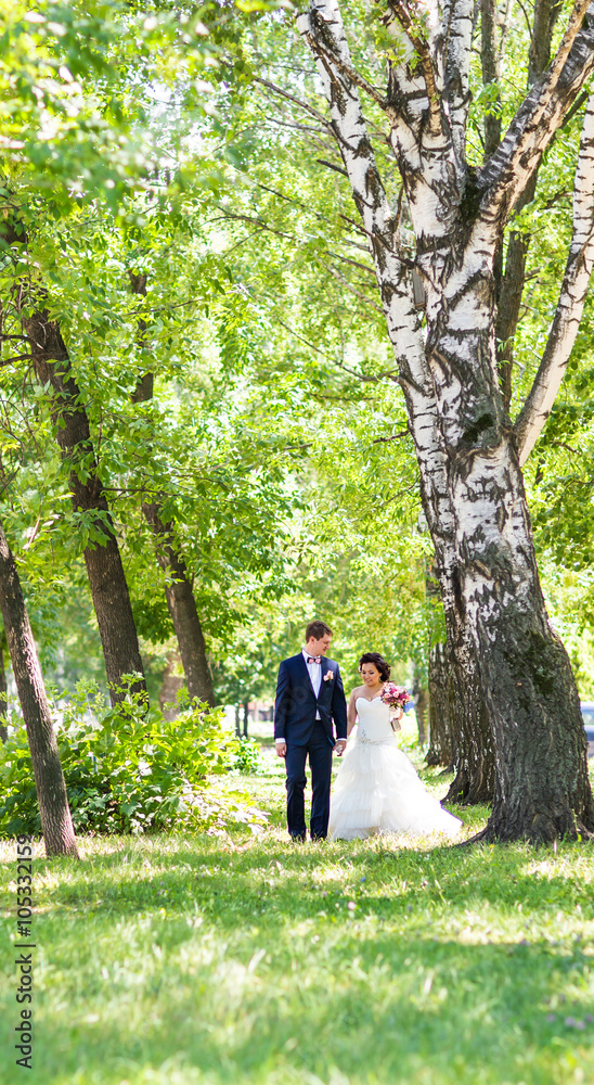 Fototapeta premium Romantic wedding couple having fun together outdoor in nature