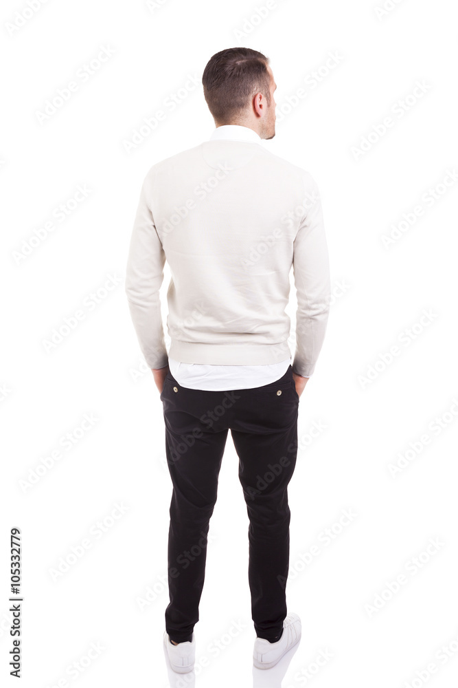 Fototapeta premium Young casual man from back, isolated on white background