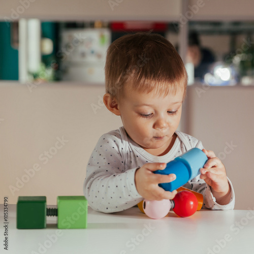 Little Boy Is Playing With Toys