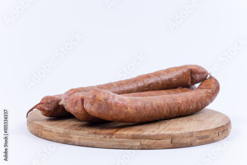 Raw sausages on the cutting board