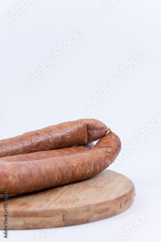 Raw sausages on the cutting board