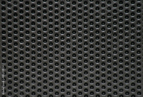 Photo of a natural perforated metal surface