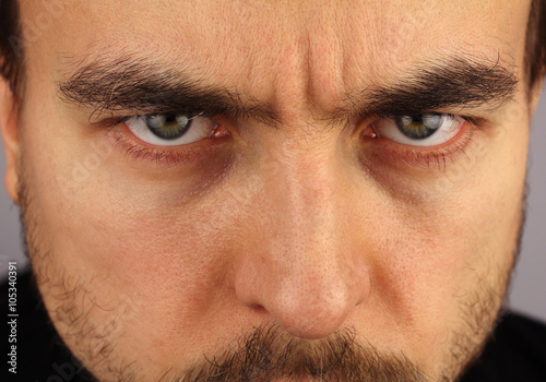 portrait of a man, menacing look, closeup