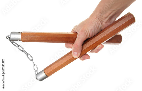 Nunchaku in a hand to isolate on the white