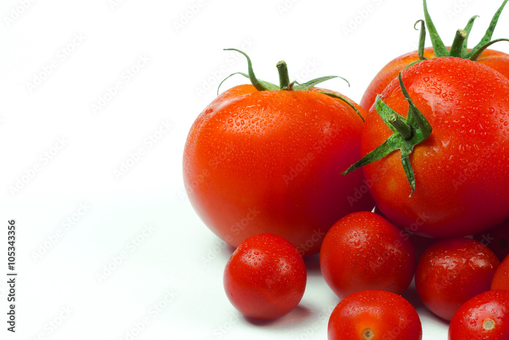 Tomatoes. Whole and a half isolated on white Tomatoes. Whole and a half isolated on white