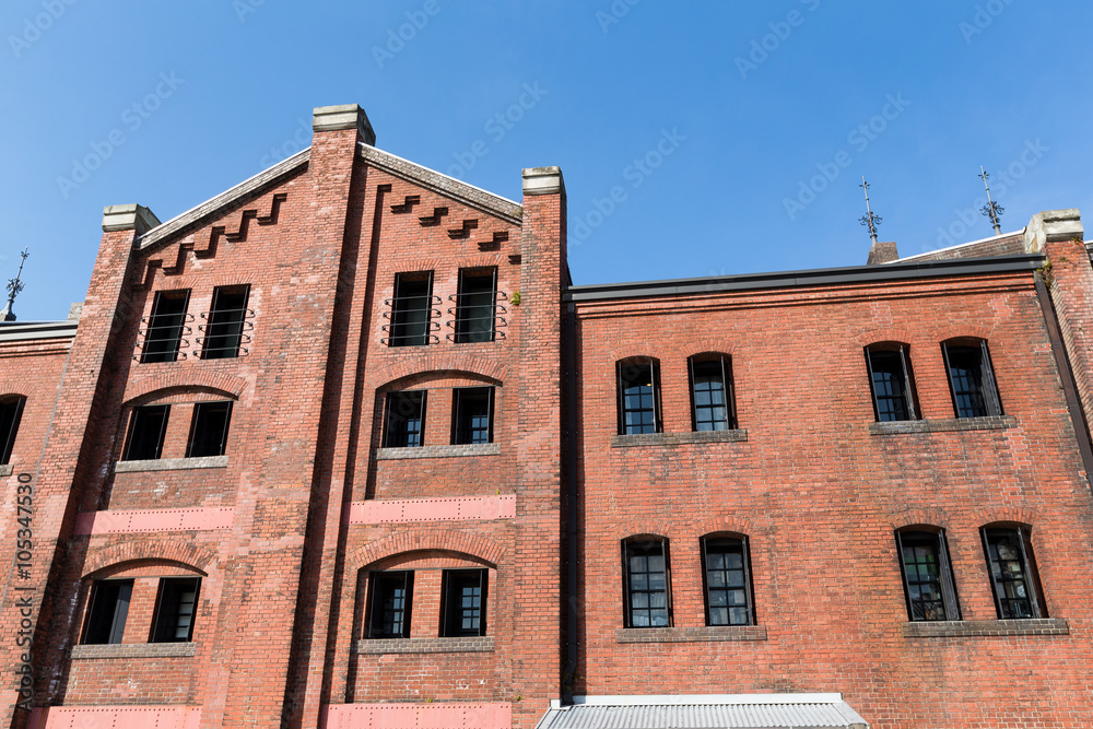 Red brick warehouse with blue sky