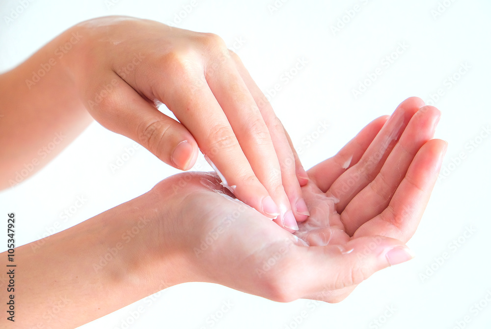 cream on woman hand with isolated background
