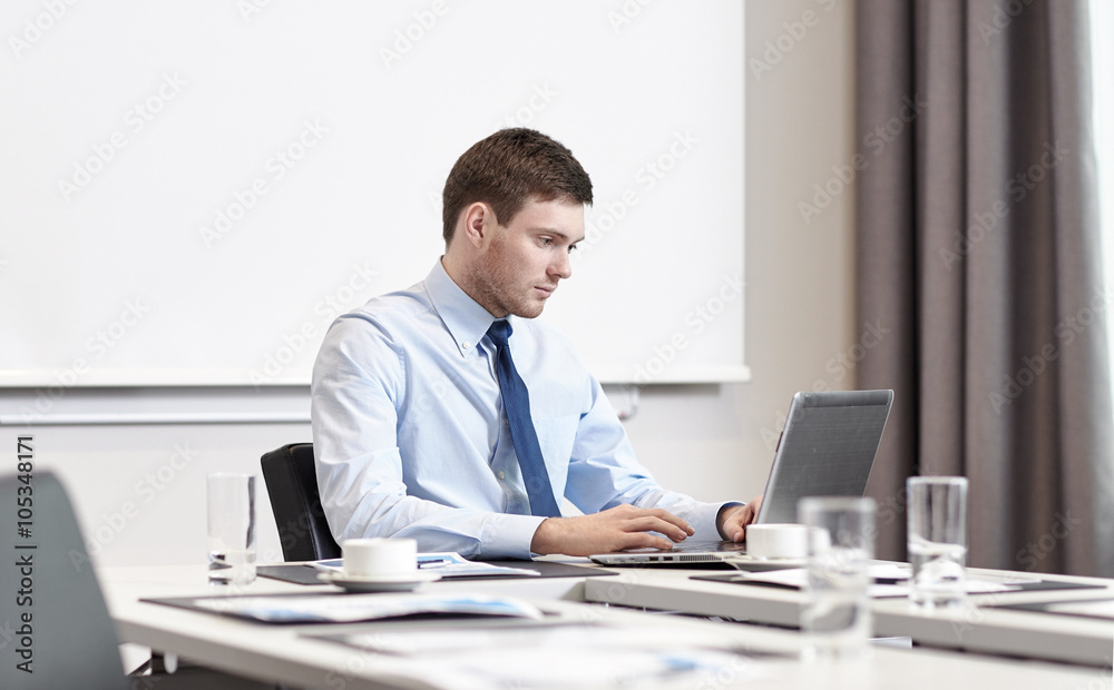 businessman with laptop working in office