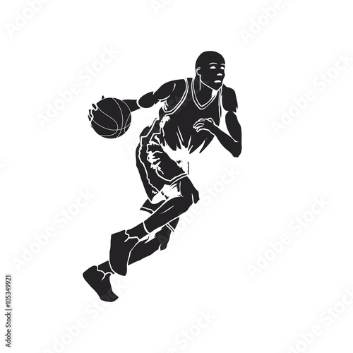 Silhouette of a basketball player dribbling the ball