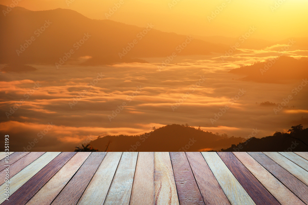 Empty top view of wooden table and view of sunset or sunrise on