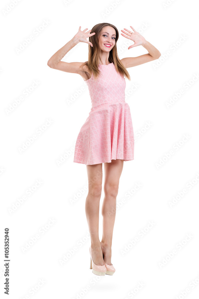 Full length of sensual woman in short dress jumping against isolated white Full length of sensual woman in short dress jumping against isolated white