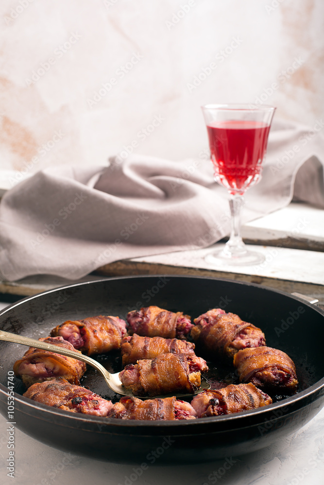 Rich snack of bacon and bread stuffed with cheese