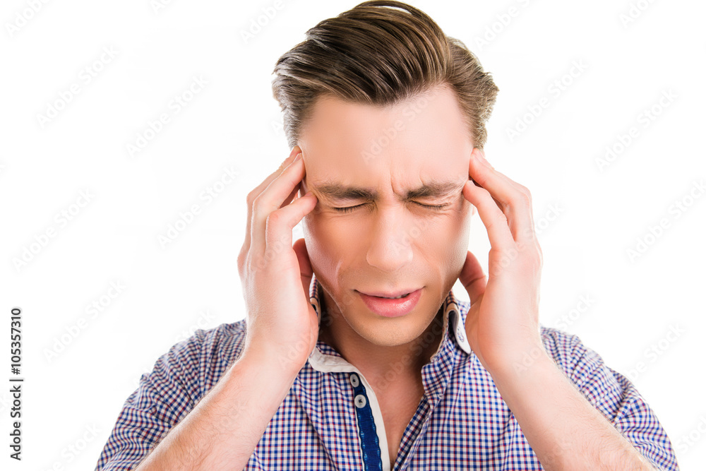 Young sad businessman with big problems touching his head