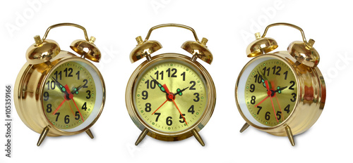 alarm clock Golden color on a white isolated background