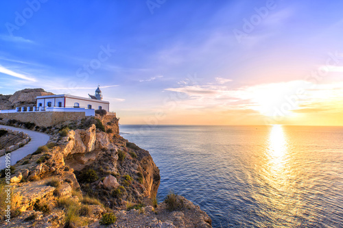 Albir lighthouse beautifully located on top of a cliff photo
