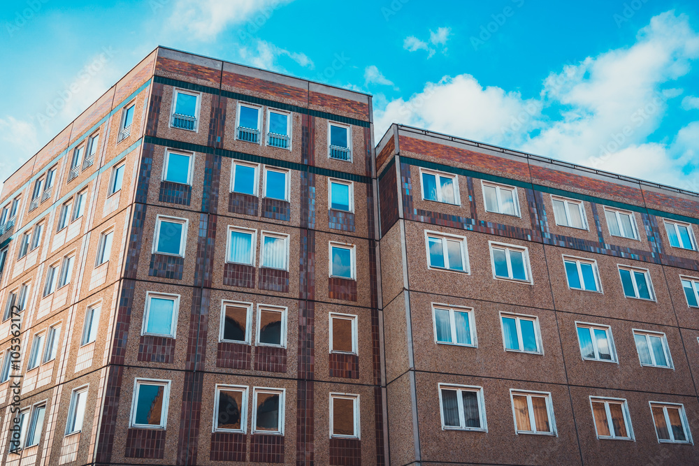 Fototapeta premium Flat brick apartment building with new windows