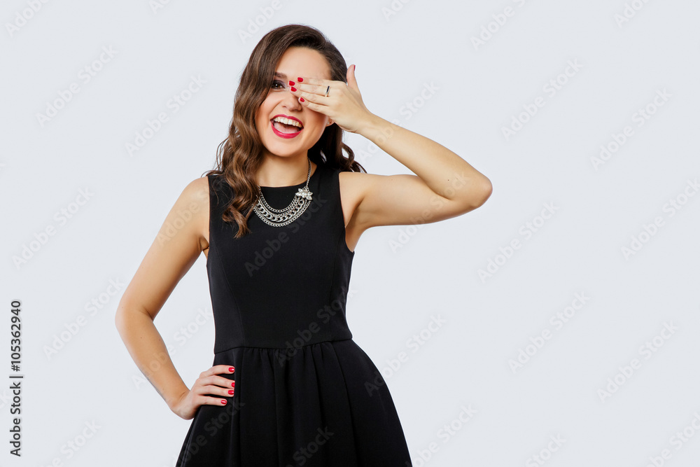 Cheerful brunette woman close her eye by her hand Cheerful brunette woman close her eye by her hand