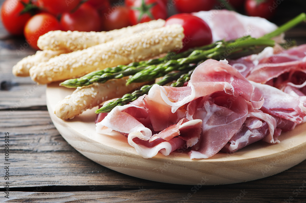 Antipasto with ham and green asparagus Antipasto with ham and green asparagus