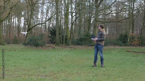 A man is operating a drone, 4K UltraHD, 4K UltraHD photo