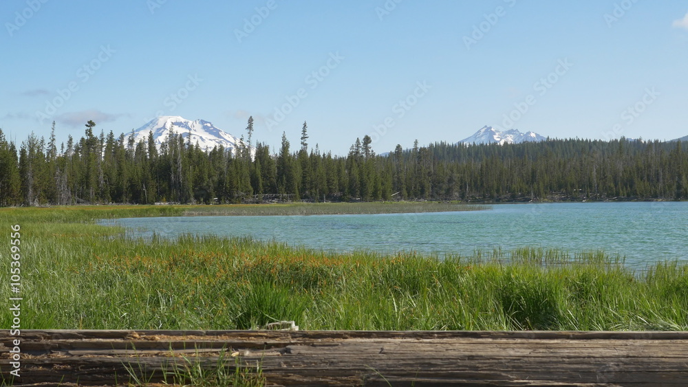 Early morning tracking shot of South Sister and Broken Top mountains with Little Lava Lake in the foreground; Deschutes National Forest, Oregon Early morning tracking shot of South Sister and Broken Top mountains with Little Lava Lake in the foreground; Deschutes National Forest, Oregon