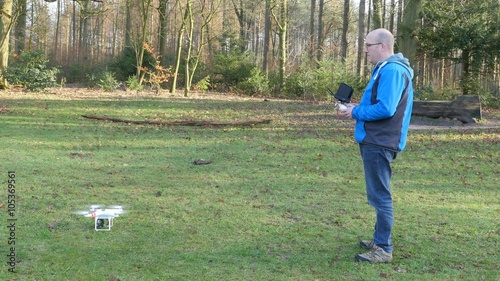 A man is operating a drone, 4K UltraHD, 4K UltraHD photo