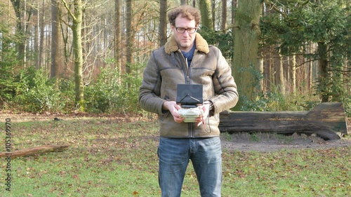 A man is operating a drone, 4K UltraHD, 4K UltraHD photo