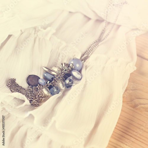 Beautiful blue pendant on a white cloth