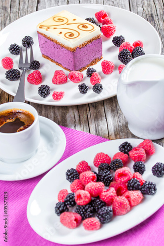 a piece of cake souffle with blackberries, raspberries, closeup
